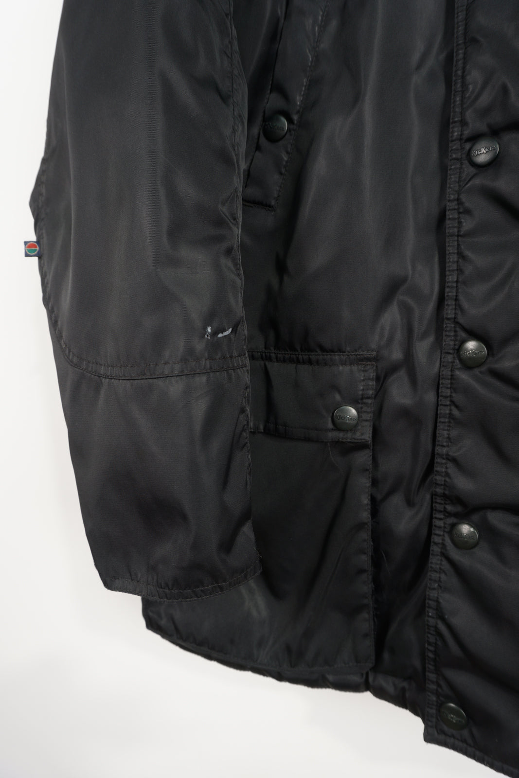 All black Kickers winter coat with detachable hood and embroidered logo on the sleeve