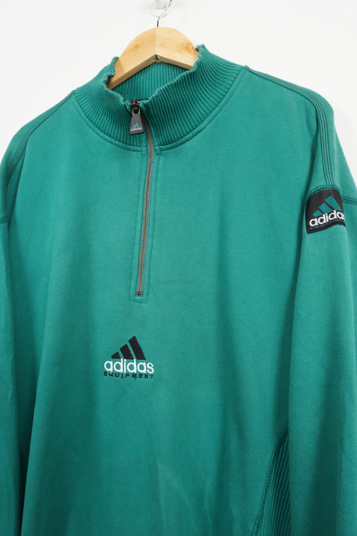 90's Adidas Equipment green 1/4 zip sweatshirt, embroidered logo on the front, and badge on sleeve good condition, small mark of discolouring on front&nbsp; Size in Label: L