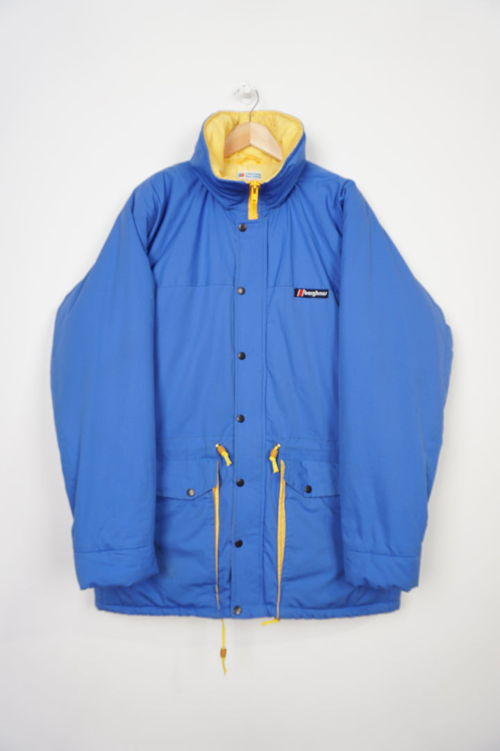 Vintage Berghaus blue Gortex waterproof padded coat with drawstring waist and foldaway hood 