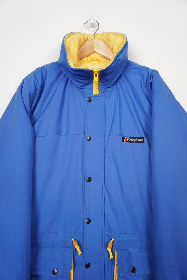 Vintage Berghaus blue Gortex waterproof padded coat with drawstring waist and foldaway hood 