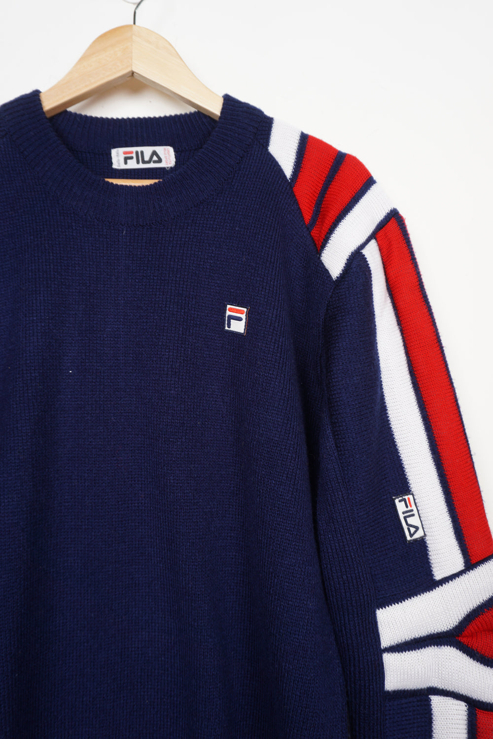 Vintage navy blue colour block Fila knit jumper with embroidered logo on the chest and padded details on the sleeve