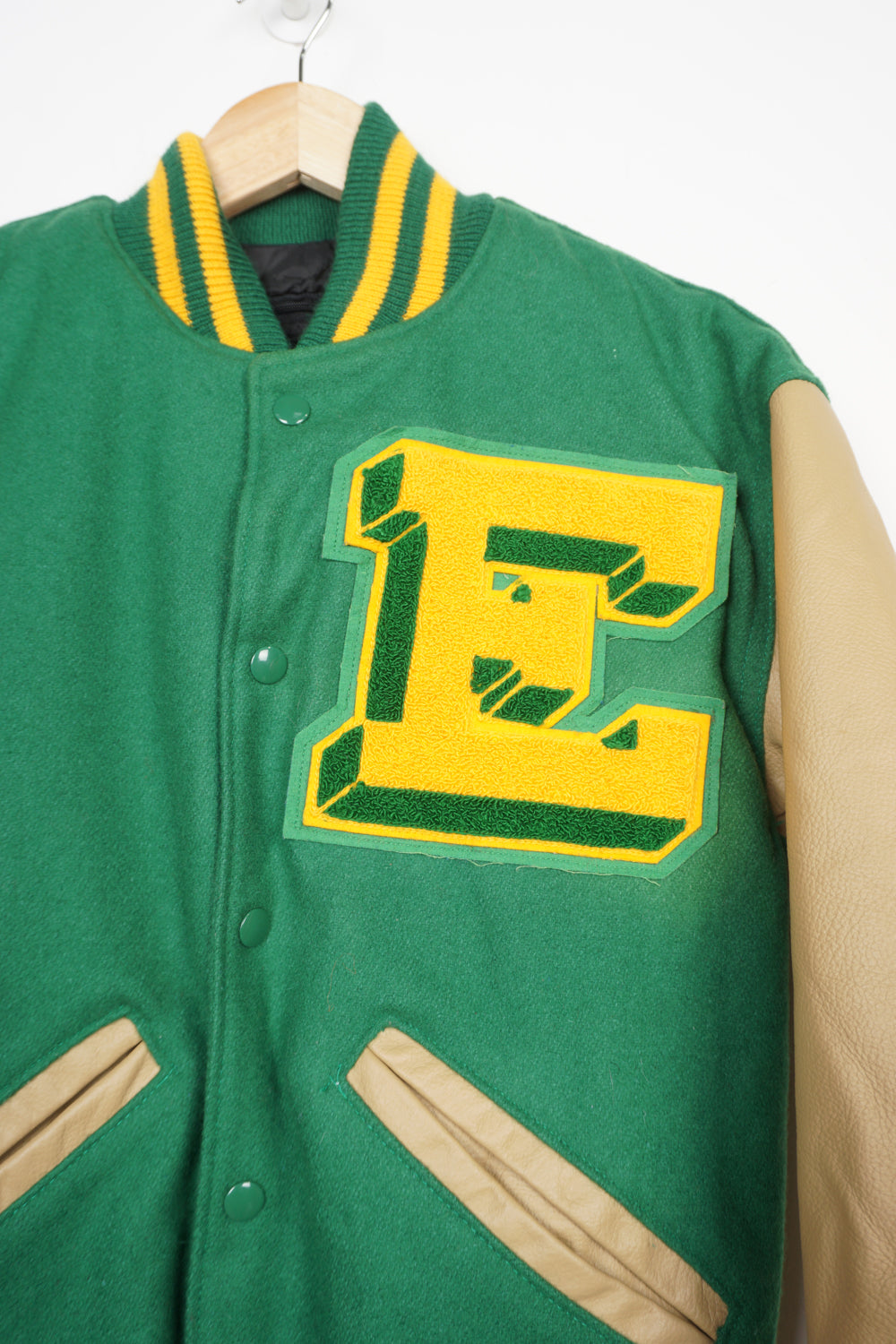 Vintage 80's Varsity jacket in bright green with light brown leather sleeves by Neff Since 1949.