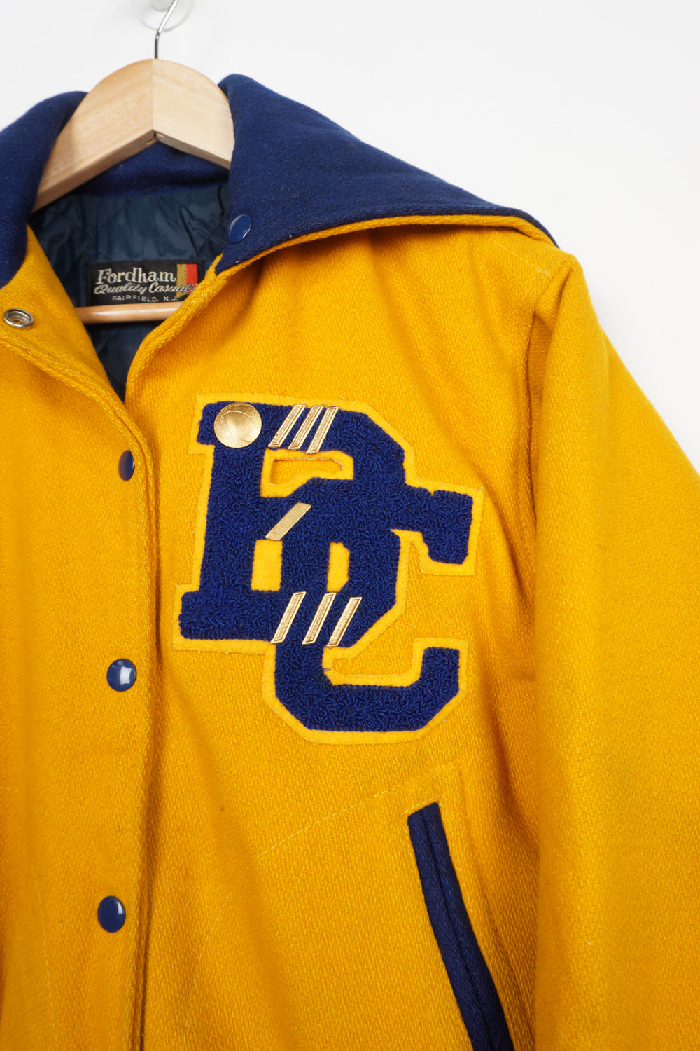 Vintage all yellow wool cheerleading letterman jacket with zip up hood and embroidered lettering