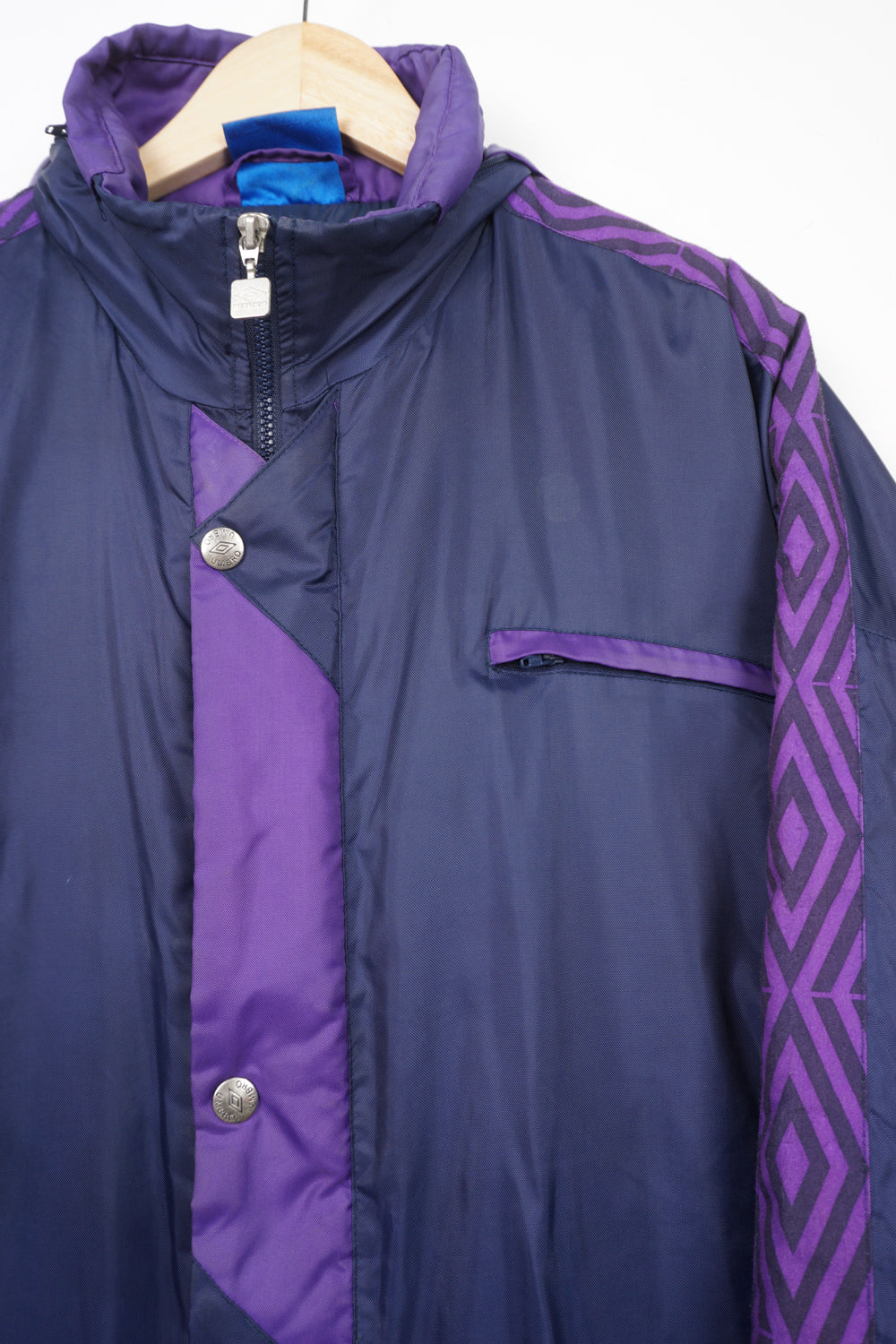 Vintage purple and navy blue zip through Umbro coat with embroidered logo on the chest and foldaway hood