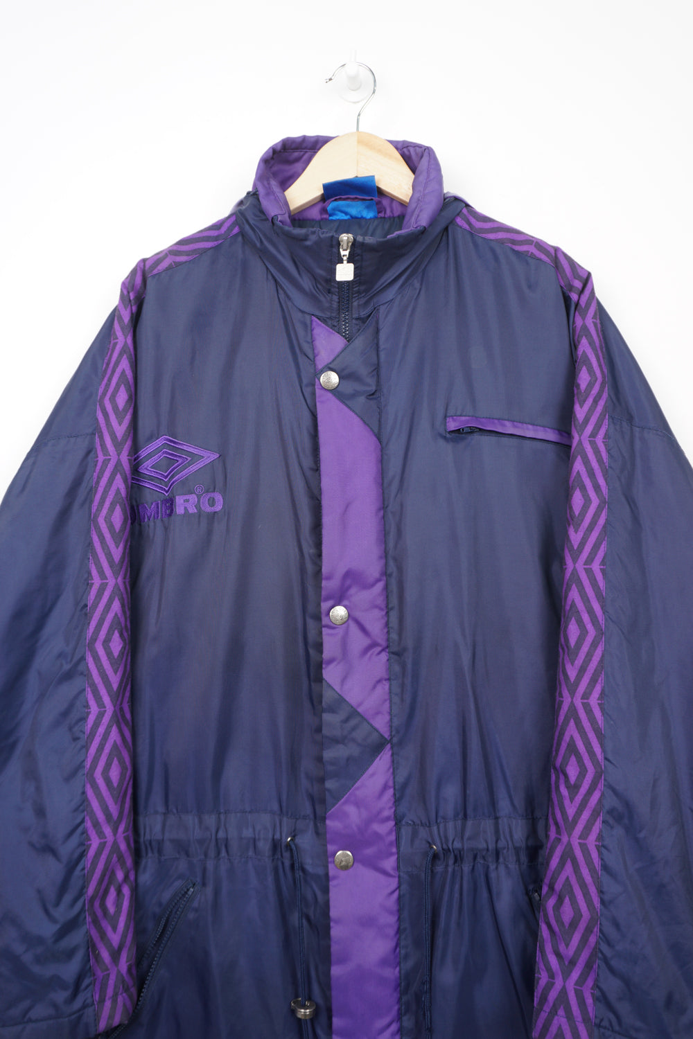 Vintage purple and navy blue zip through Umbro coat with embroidered logo on the chest and foldaway hood