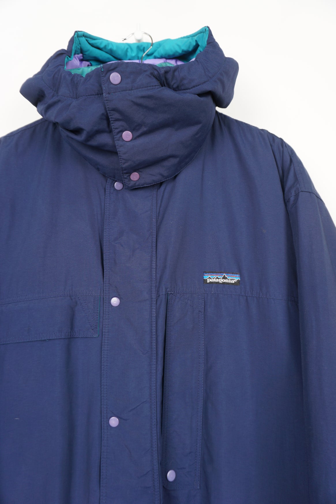 Vintage Patagonia navy blue zip through padded coat with removable hood and embroidered logo on the chest