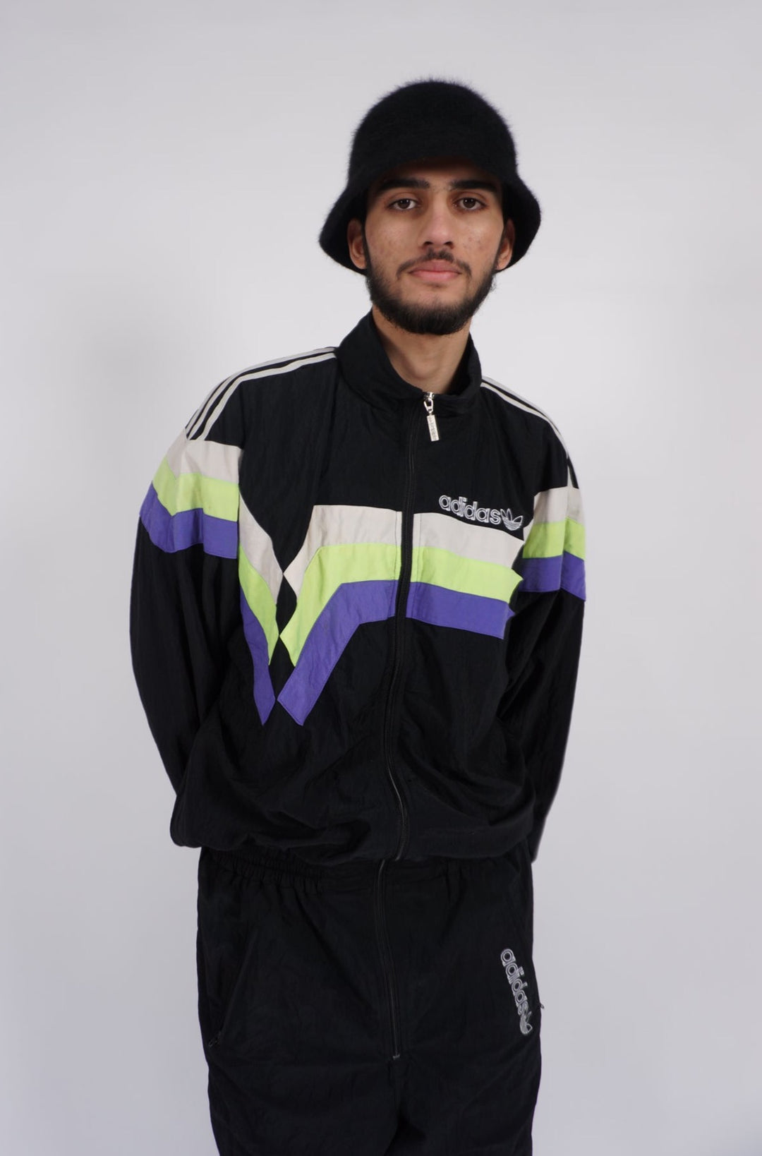 Black Adidas zip through belted one piece ski suit, with embroidered logo on the front and back