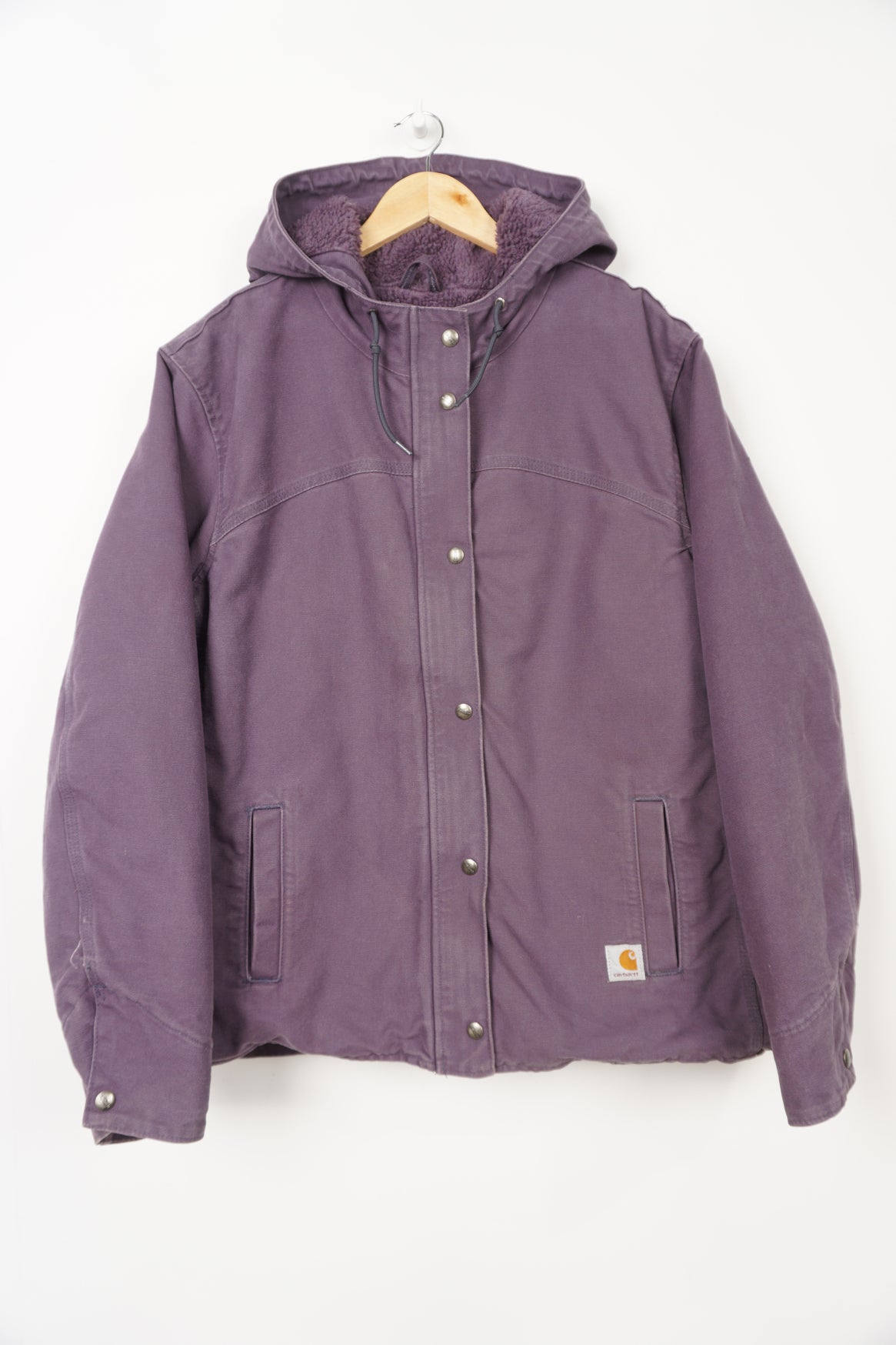 Purple heavy duty cotton hooded Carhartt jacket with embroidered logo on the pocket and fleece lining