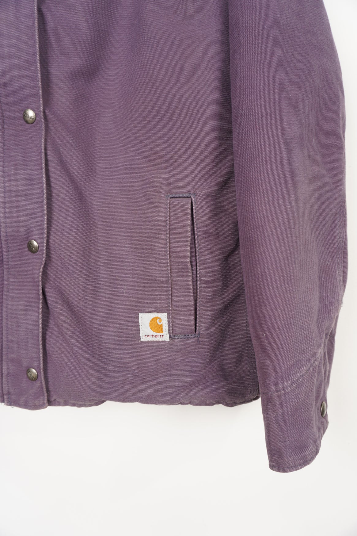 Purple heavy duty cotton hooded Carhartt jacket with embroidered logo on the pocket and fleece lining