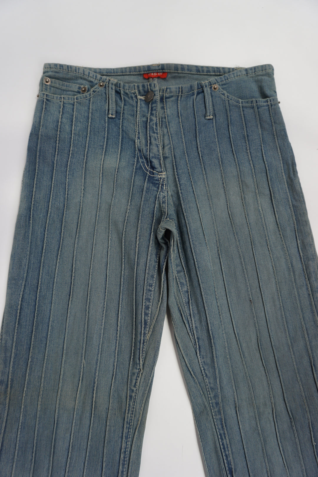 Vintage 2000's low rise, slim fit slightly flared jeans with ribbed seam details all over