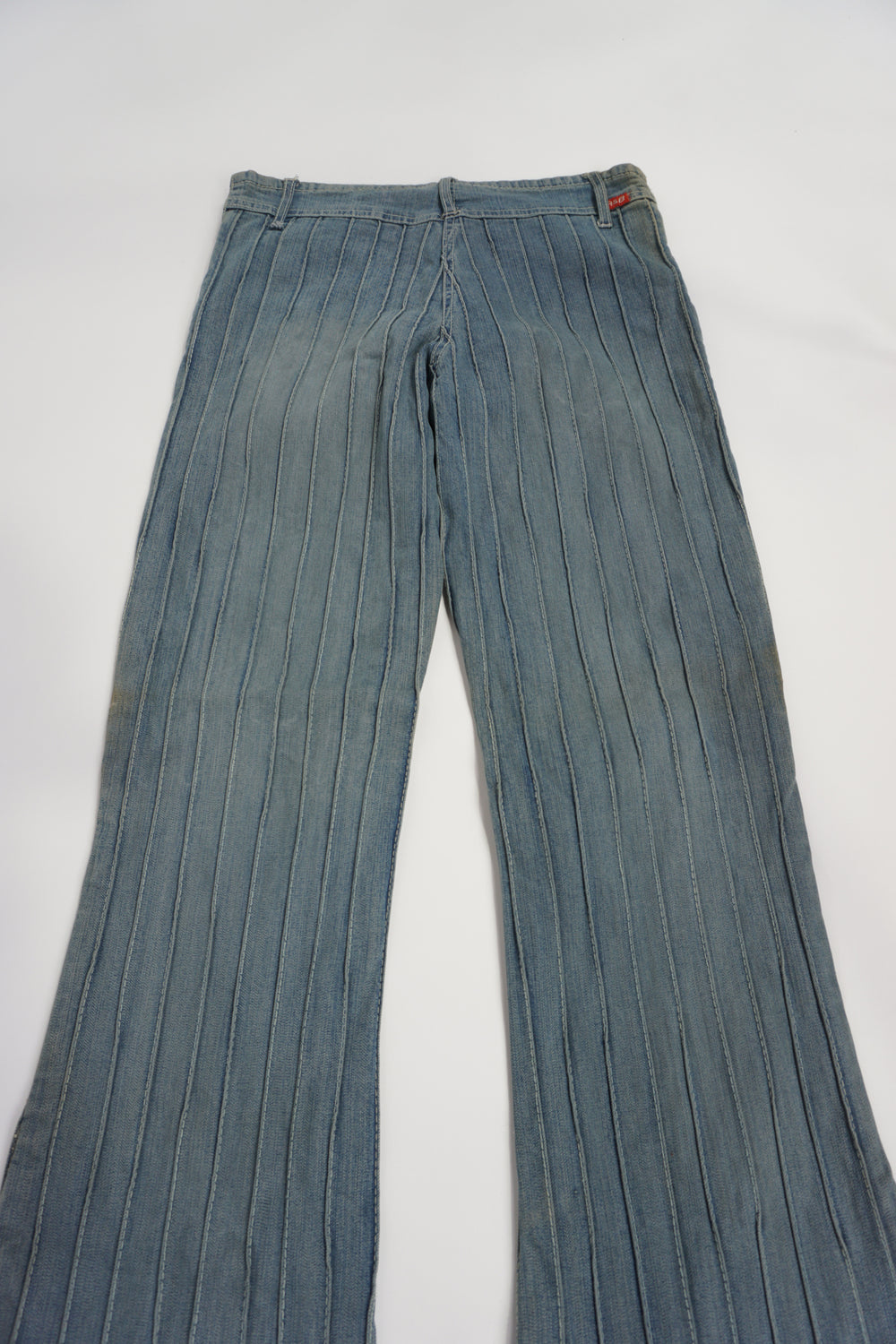 Vintage 2000's low rise, slim fit slightly flared jeans with ribbed seam details all over