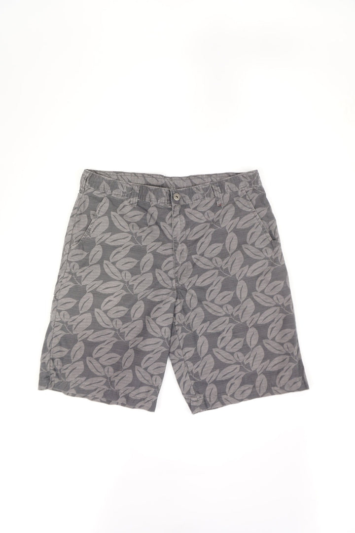 Grey Dickies shorts with logo on back pocket. Features a surfer style leaf print in a lighter grey.