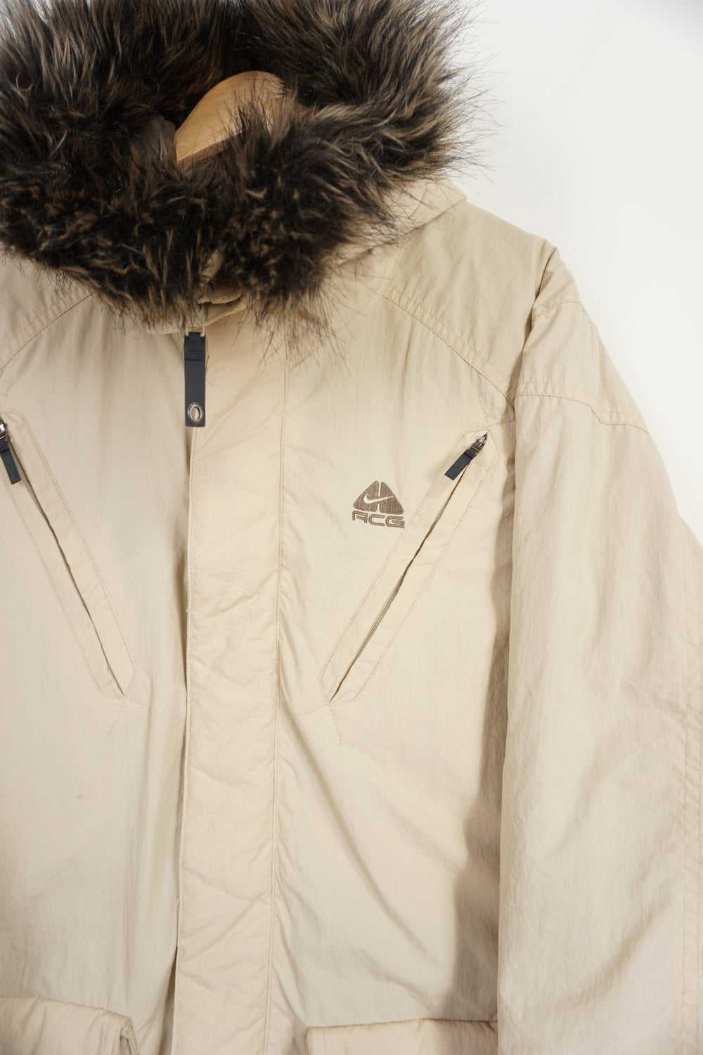 Nike ACG zip through coat with high neck, pockets and faux fur on collar