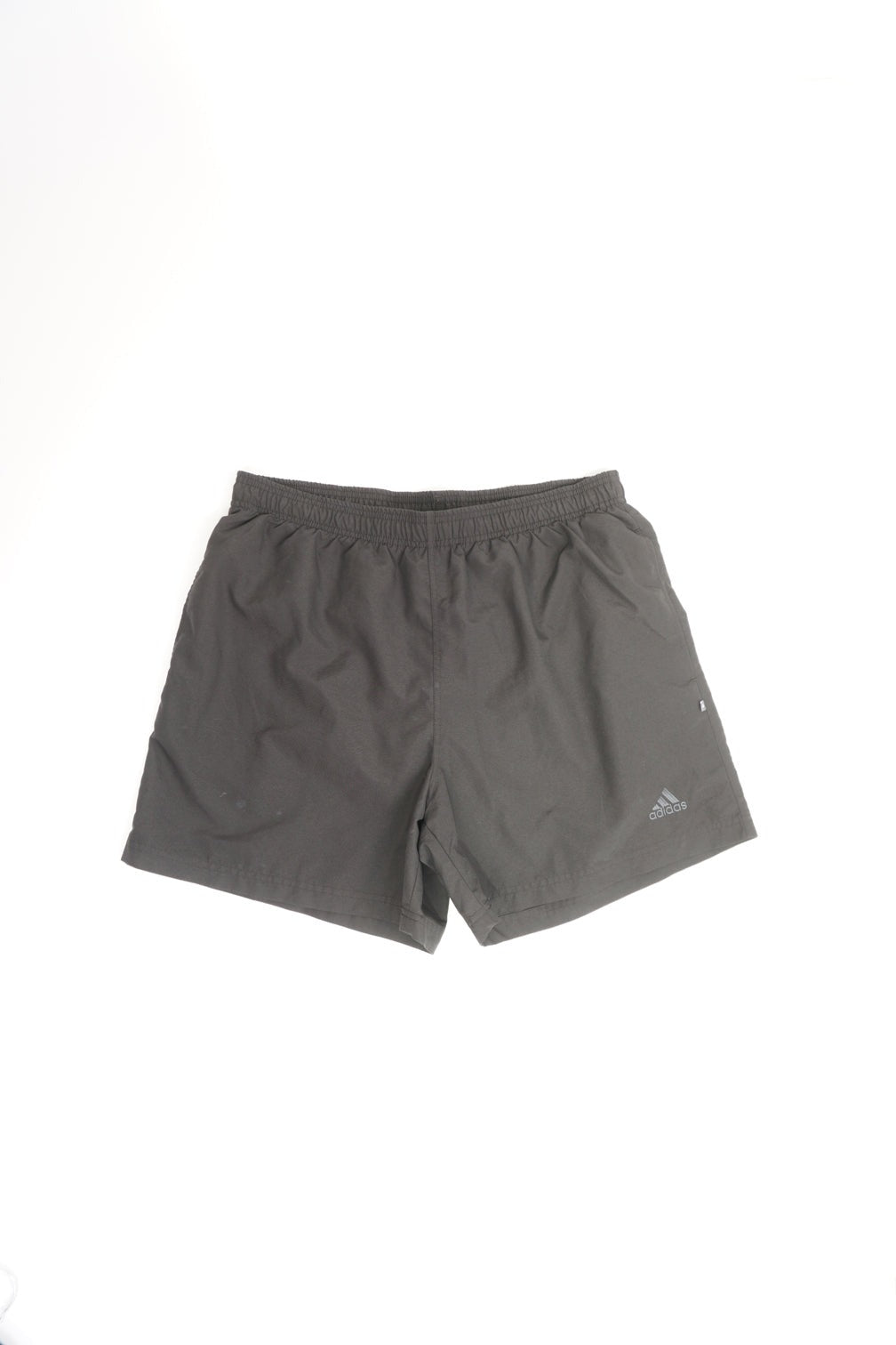 00's / Y2K Adidas black polyester shorts. Features an elasticated waistband with a drawstring tie and has an embroidered logo on the front leg.