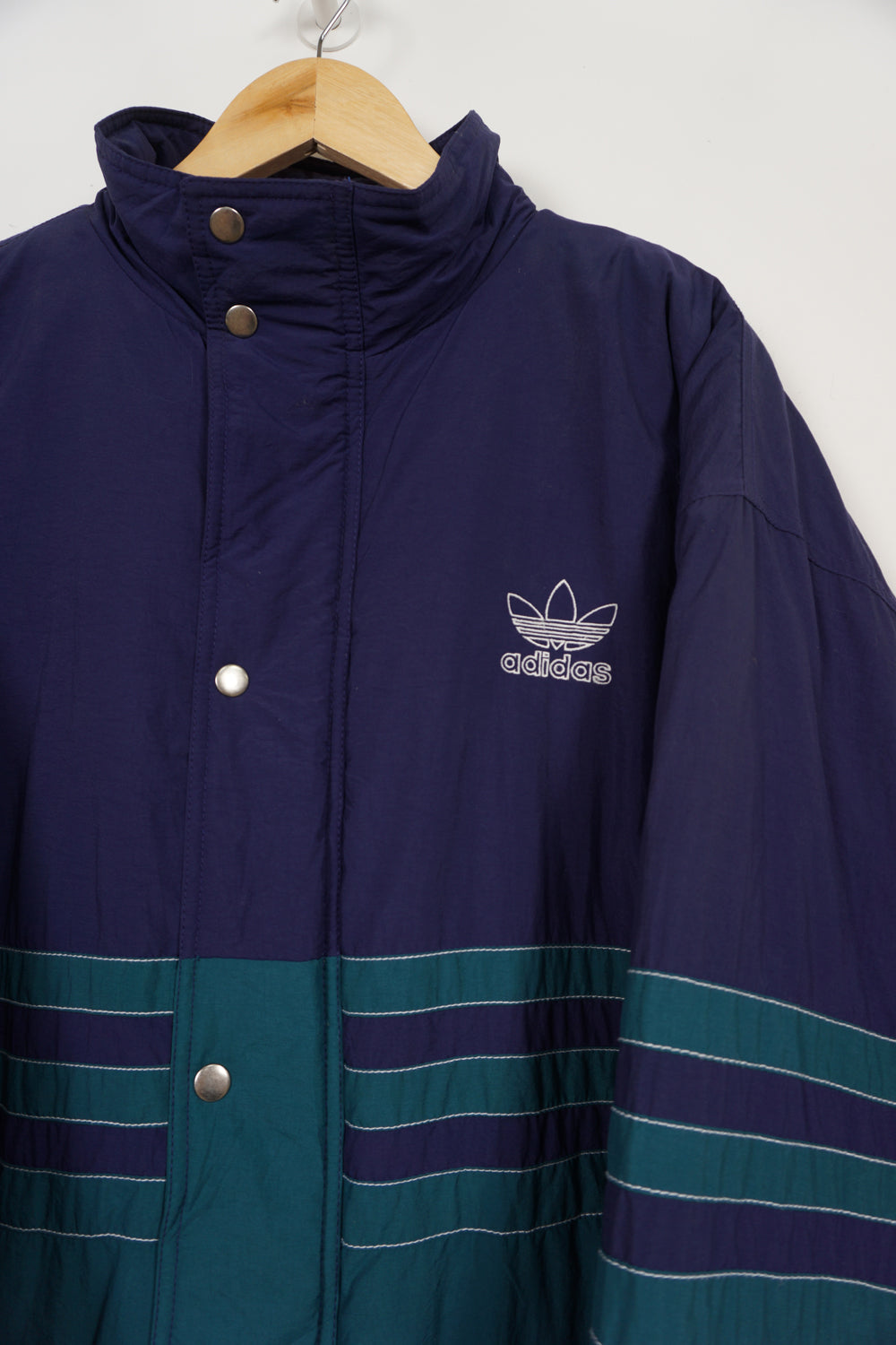 Vintage 90's green and blue Adidas padded sports coat, with embroidered logo on the chest and drawstring waist