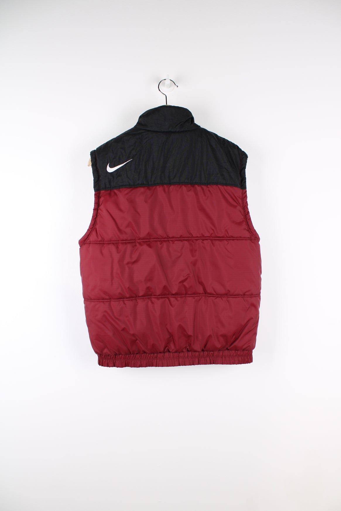 Vintage Nike burgundy puffer gilet. Featuring black panel and embroidered logo on the chest.