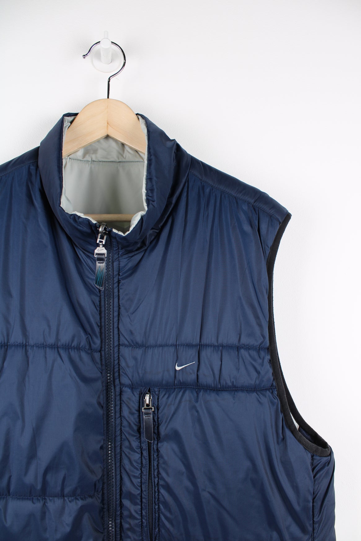 Vintage Nike reversible light puffer vest in blue and grey.