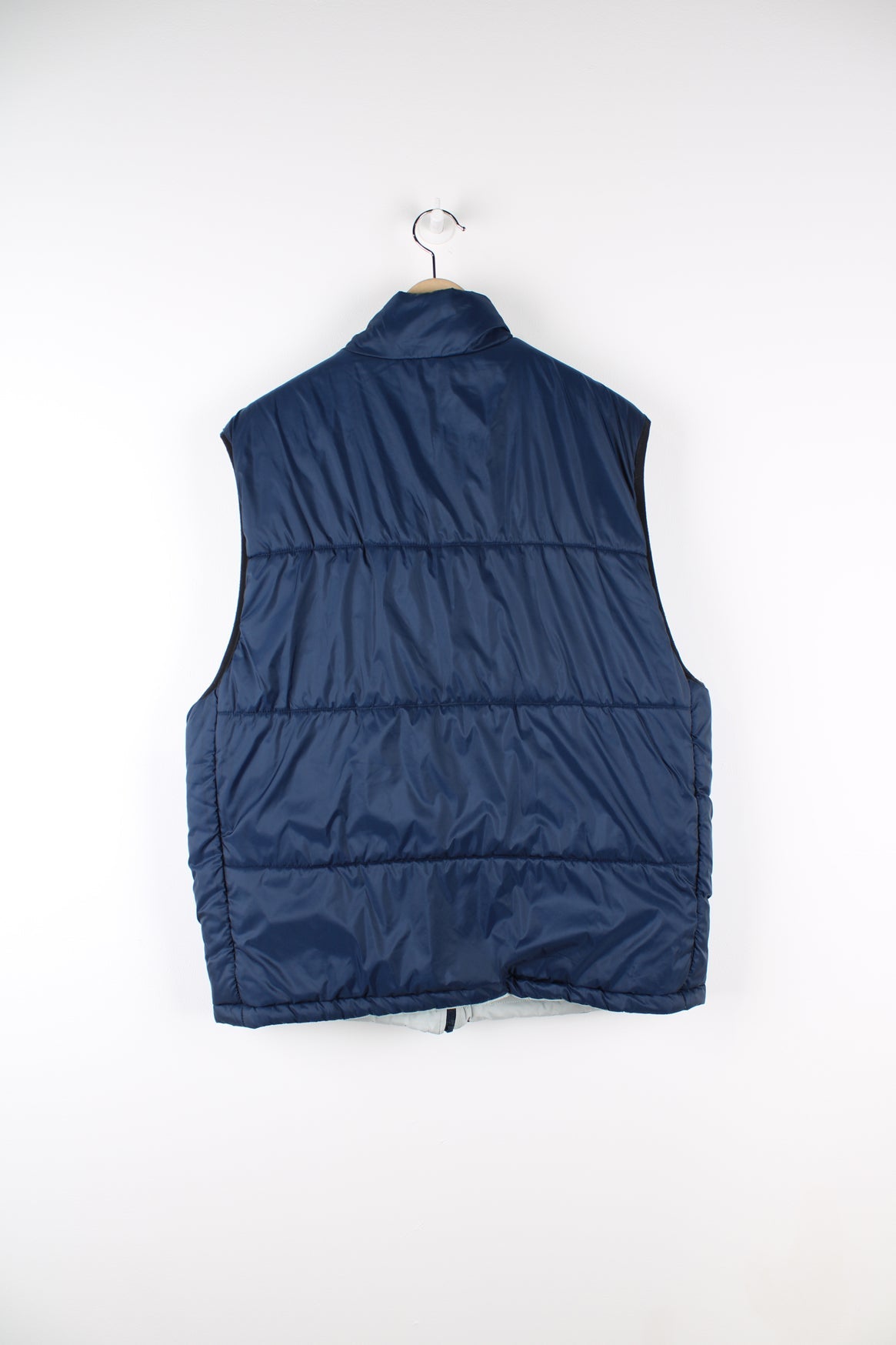 Vintage Nike reversible light puffer vest in blue and grey.