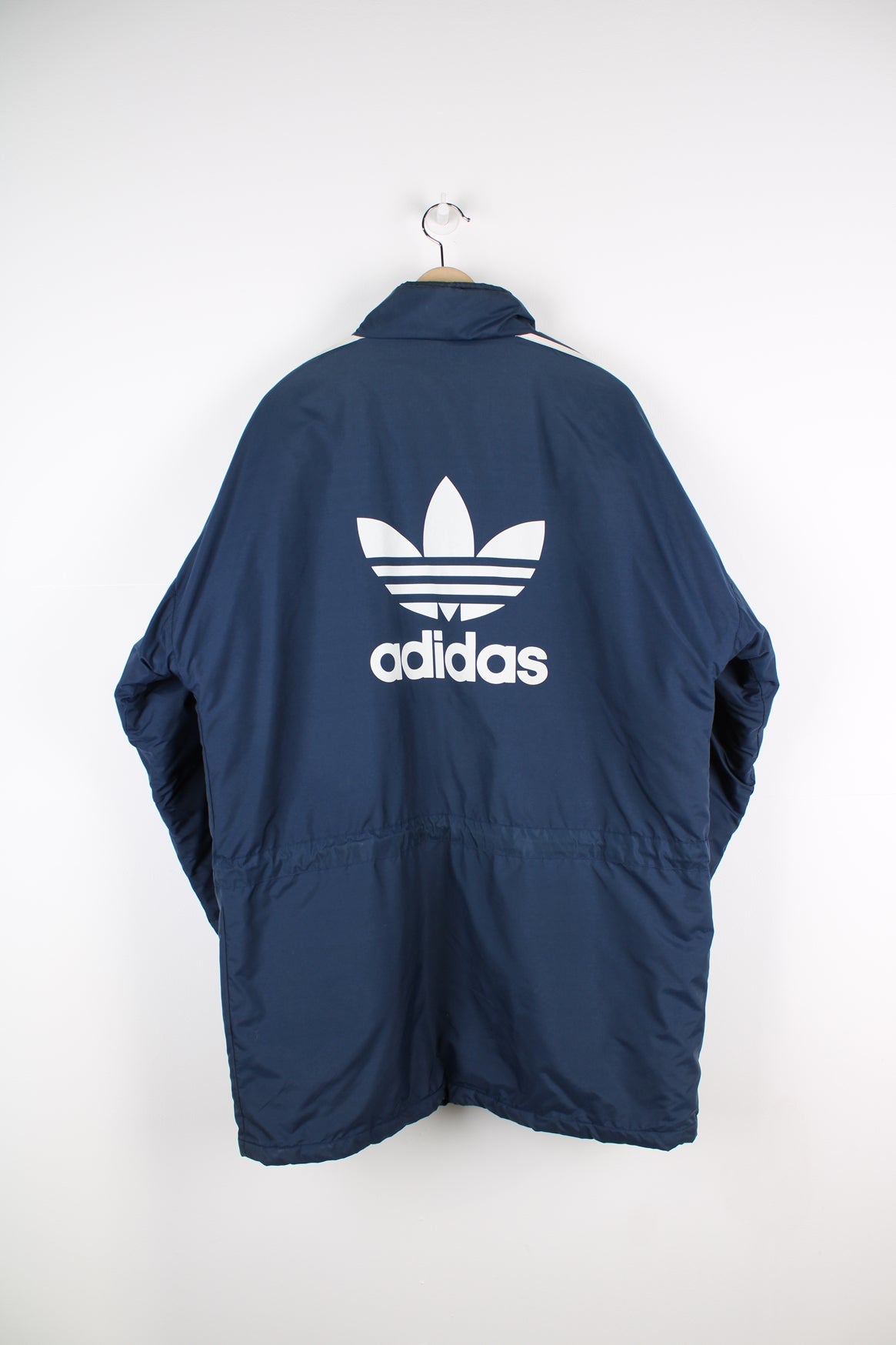 Blue Adidas coat featuring classic 3 stripes down the sleeves and printed logo on the chest and the back.