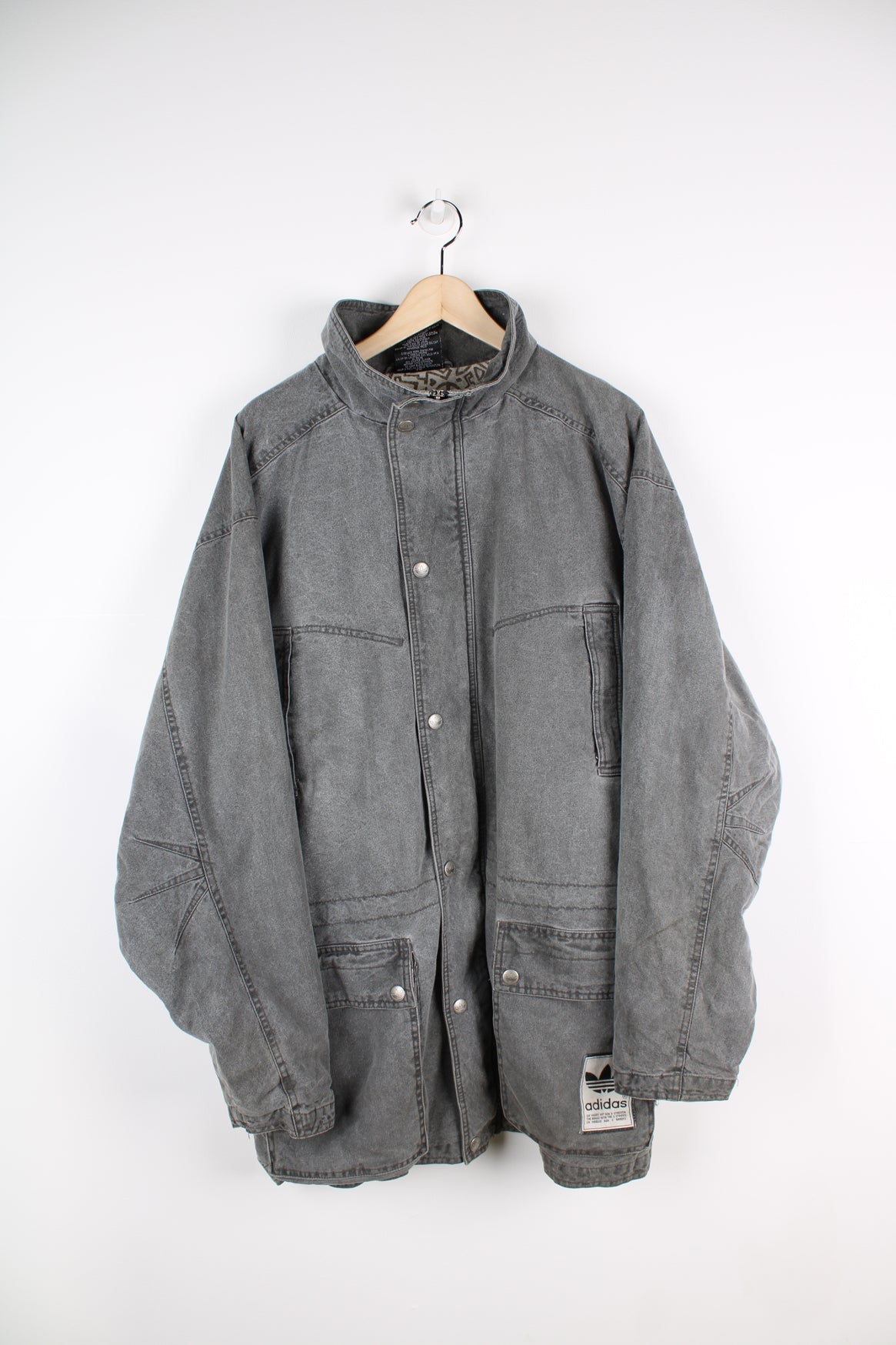 Adidas grey stonewash denim coat. Features embroidered logo on lower pocket.