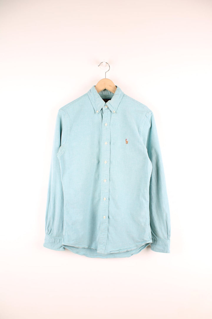 Ralph Lauren blue button up shirt with signature embroidered logo on the chest.