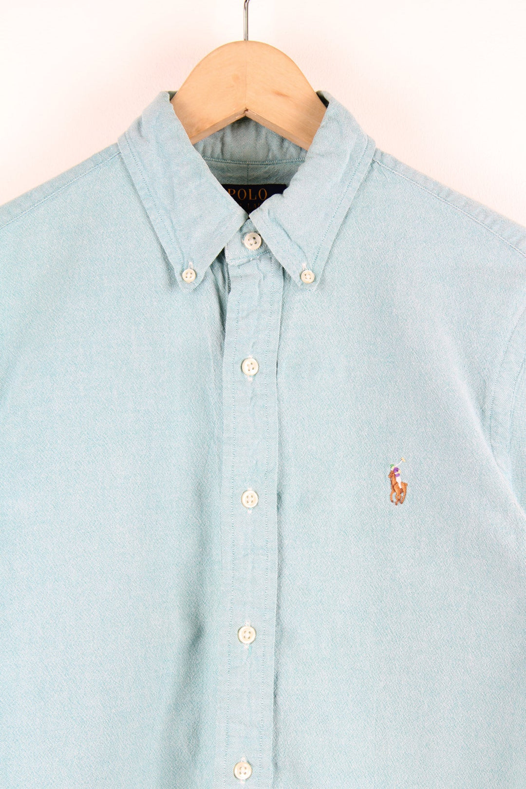 Ralph Lauren blue button up shirt with signature embroidered logo on the chest.