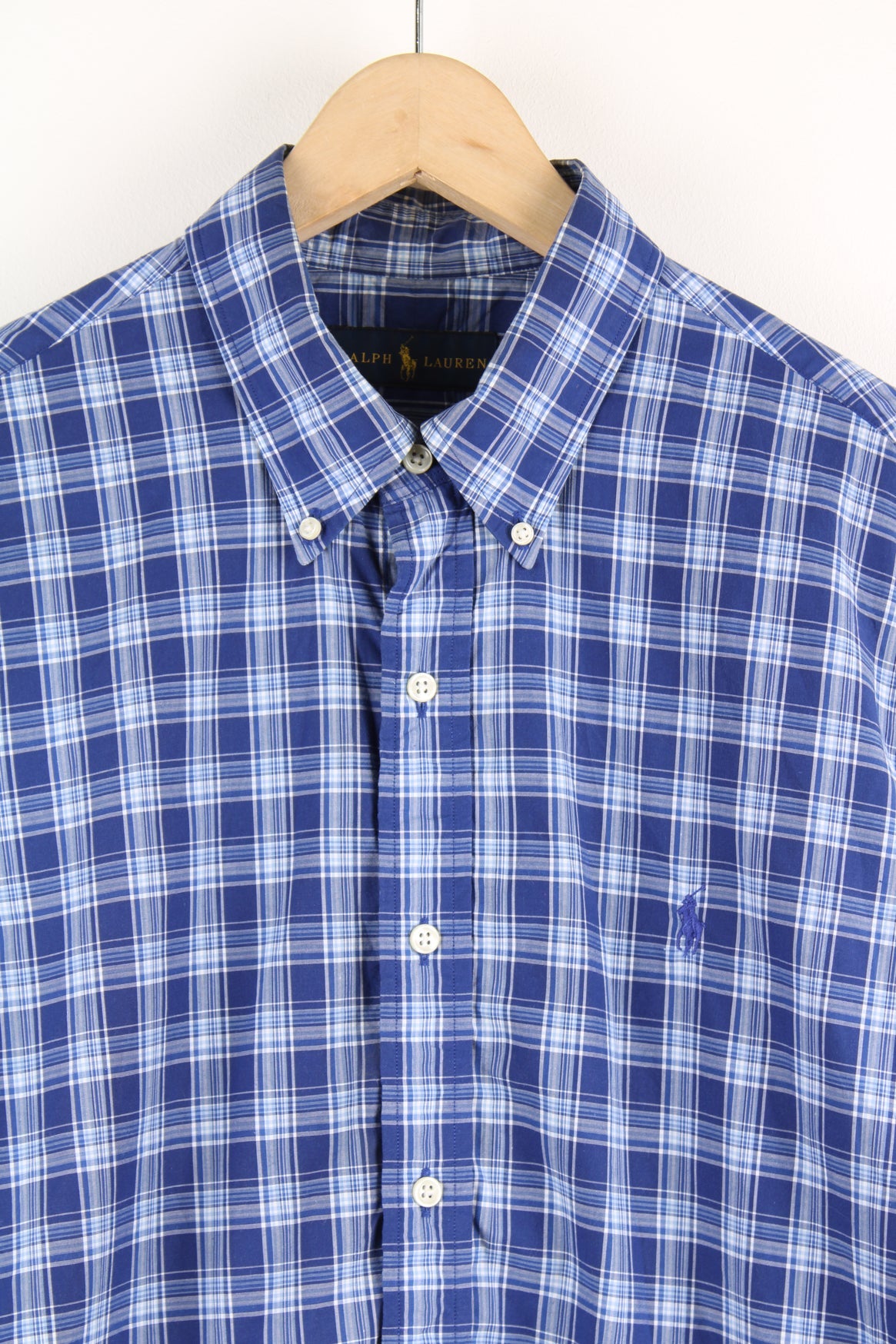 Ralph Lauren blue button up plaid shirt with signature embroidered logo on the chest.