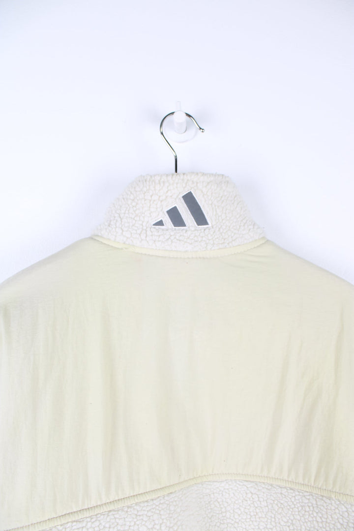 Beige Adidas pullover sherpa fleece with quarter zip and pouch pocket.