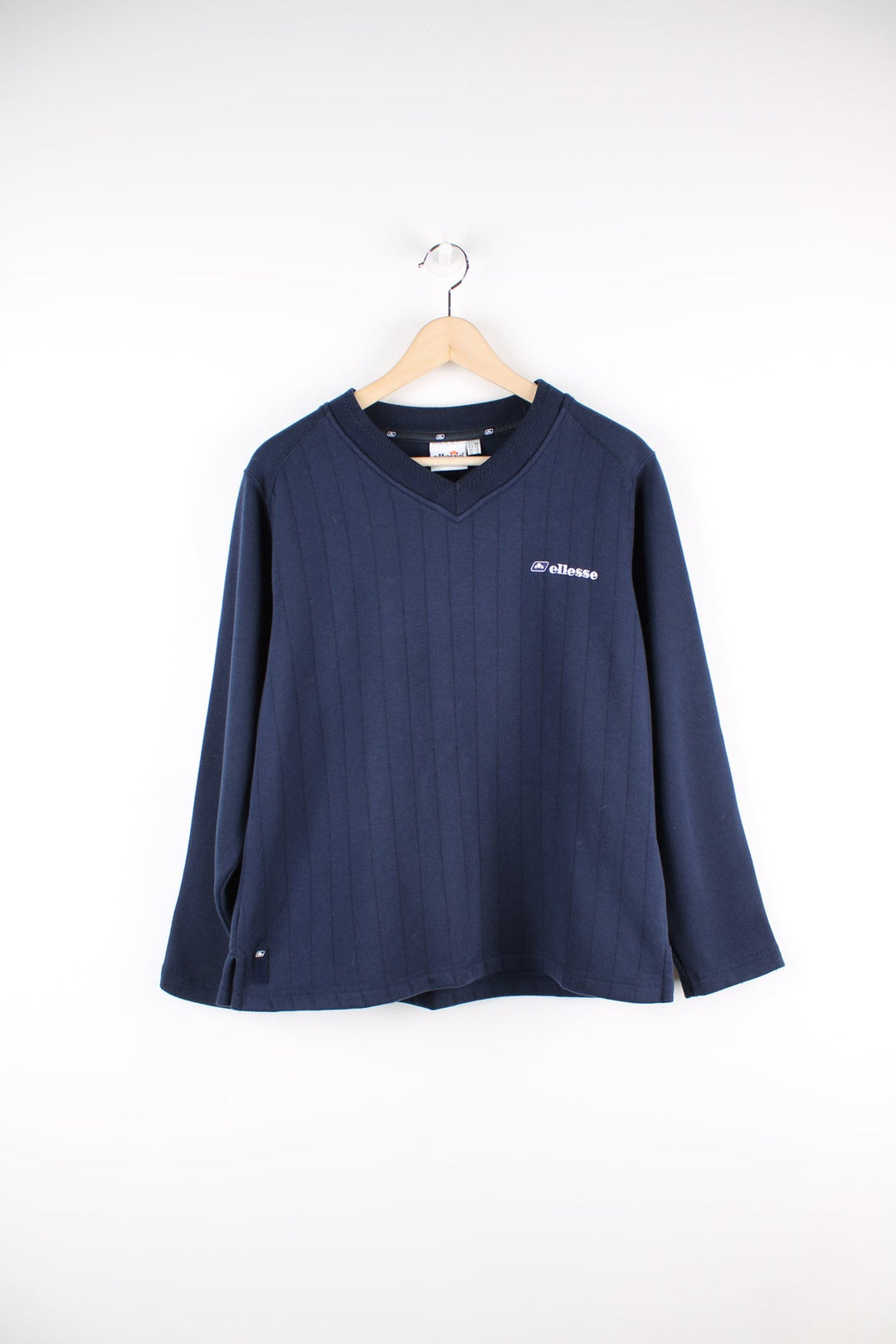 Blue vintage Ellesse v-neck sweatshirt with embroidered logo on the chest. 