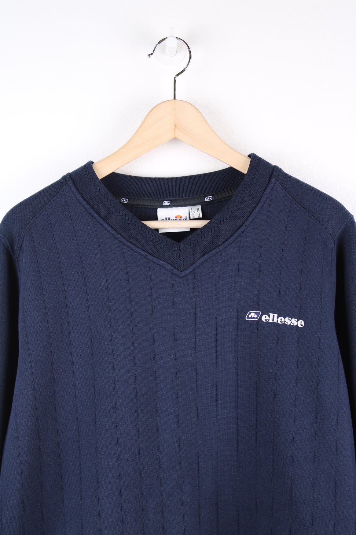 Blue vintage Ellesse v-neck sweatshirt with embroidered logo on the chest. 