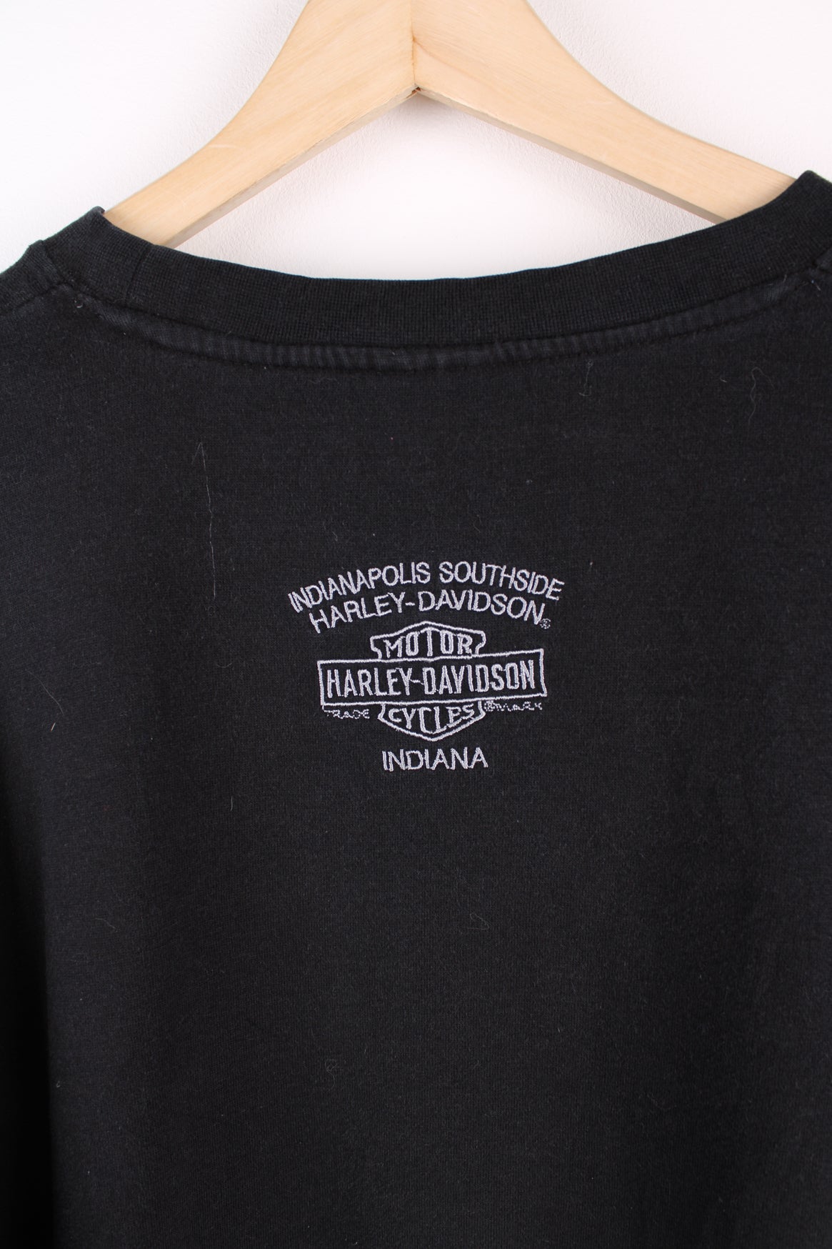 Vintage Harley Davidson black sweatshirt with grey spell-out logo across the chest and stripe feature down both sleeves.