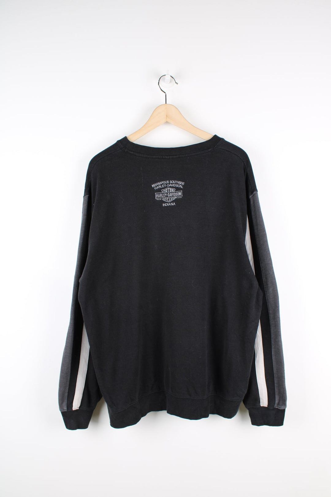 Vintage Harley Davidson black sweatshirt with grey spell-out logo across the chest and stripe feature down both sleeves.