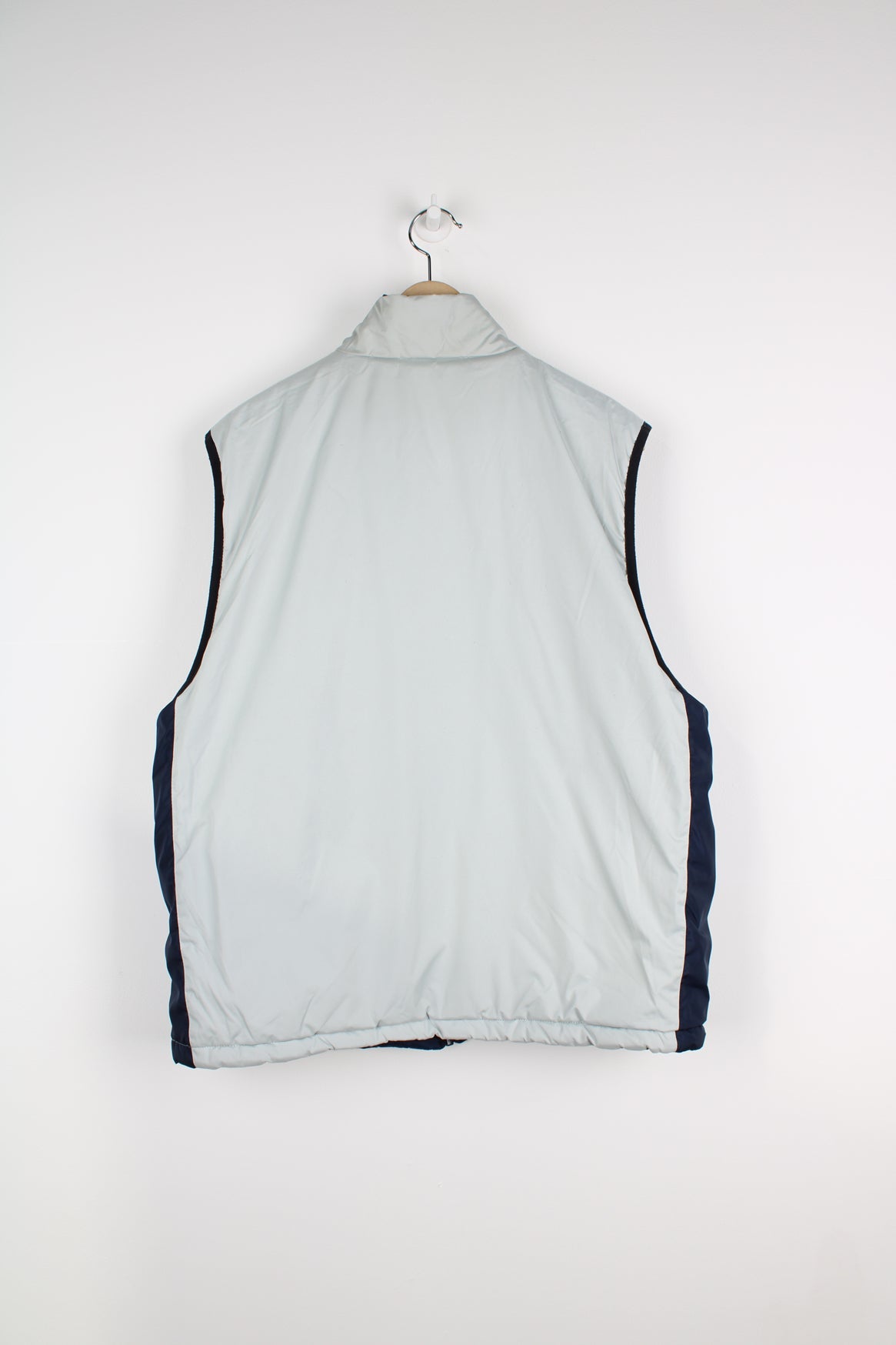 Vintage Nike reversible light puffer vest in blue and grey.