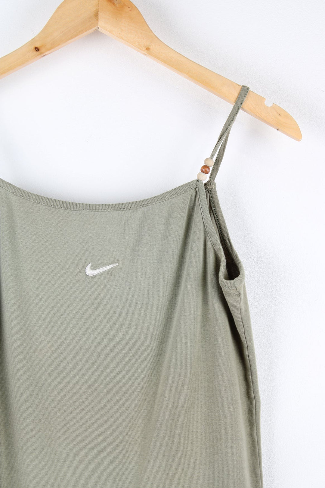 Nike cami top with embroidered logo on the chest and beads on each strap.