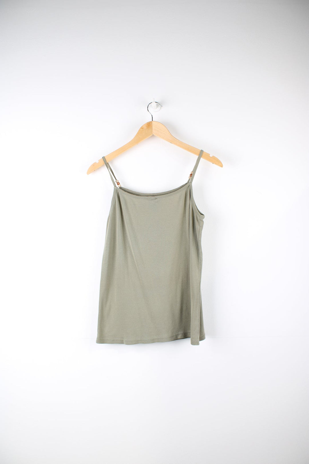 Nike cami top with embroidered logo on the chest and beads on each strap.