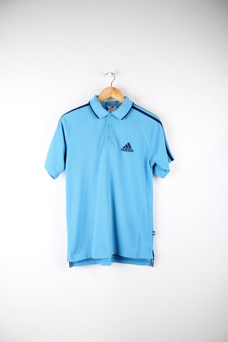 Vintage Adidas polo shirt with embroidered logo on the chest and signature three stripes on each sleeve.