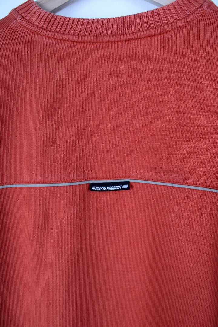 Vintage 00's orange nike sweatshirt. Features embroidered logo on the chest and brown panel details.