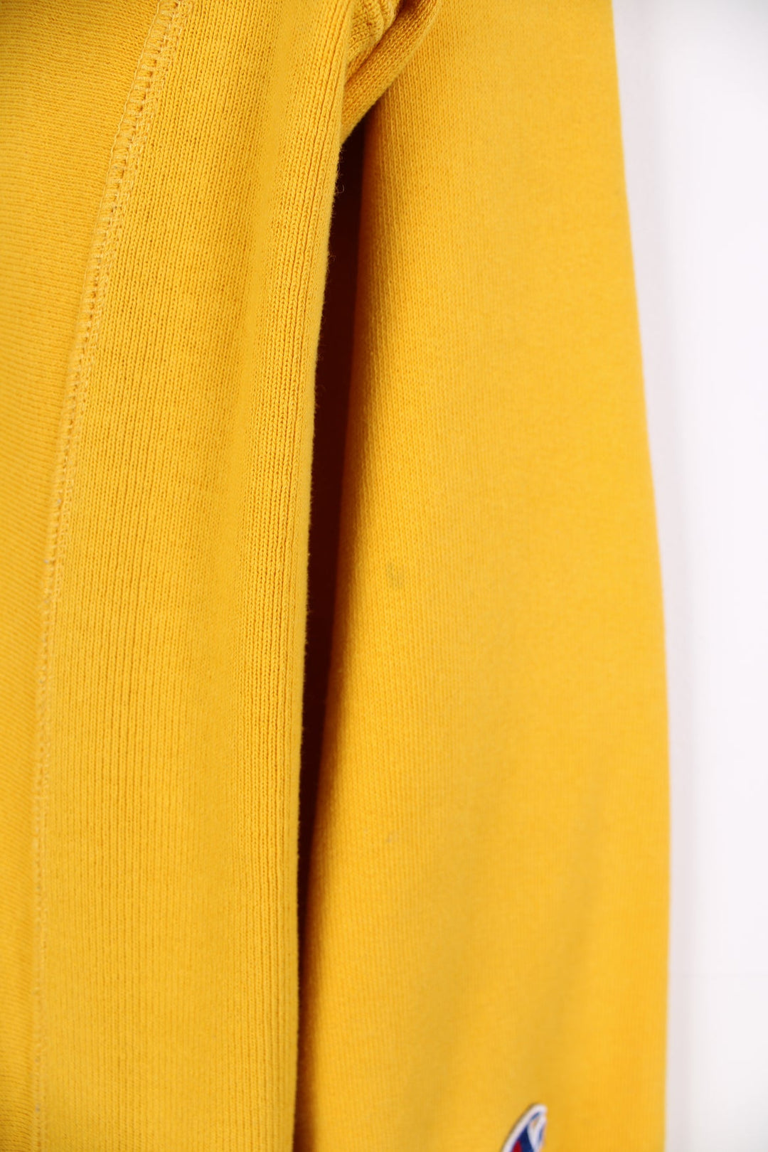 Champion Reverse Weave sweatshirt in yellow. Features embroidered logo on the chest.