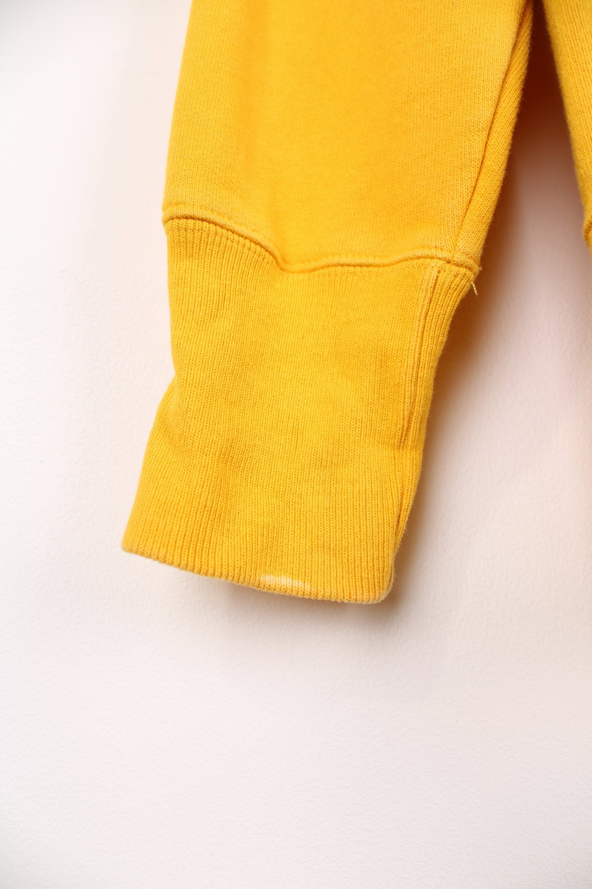 Champion Reverse Weave sweatshirt in yellow. Features embroidered logo on the chest.