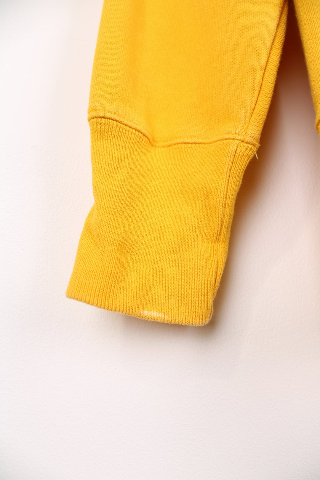 Champion Reverse Weave sweatshirt in yellow. Features embroidered logo on the chest.