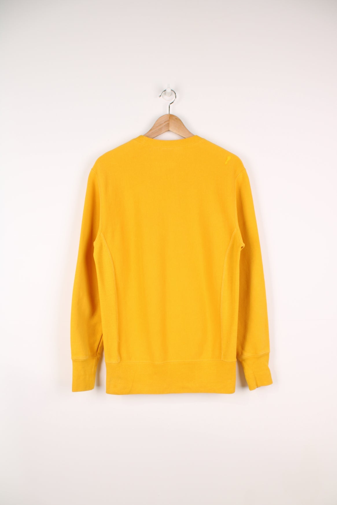 Champion Reverse Weave sweatshirt in yellow. Features embroidered logo on the chest.