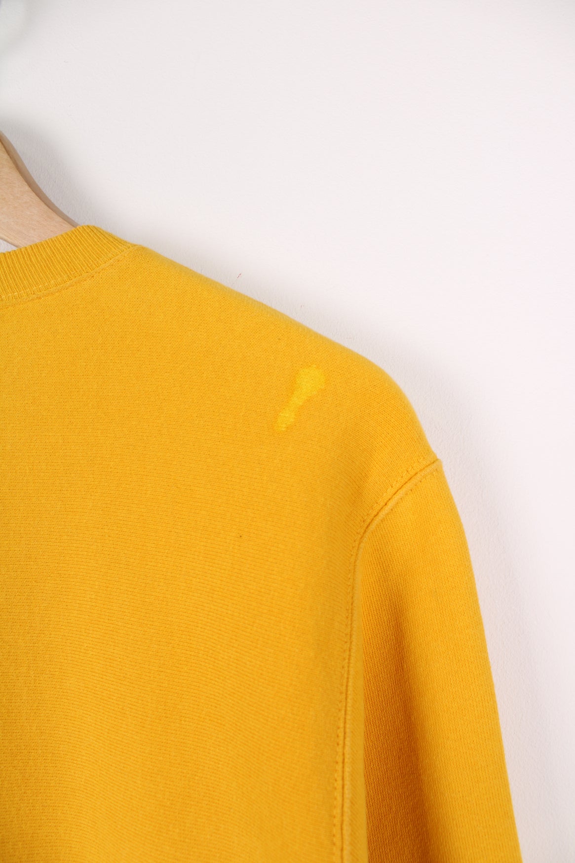 Champion Reverse Weave sweatshirt in yellow. Features embroidered logo on the chest.