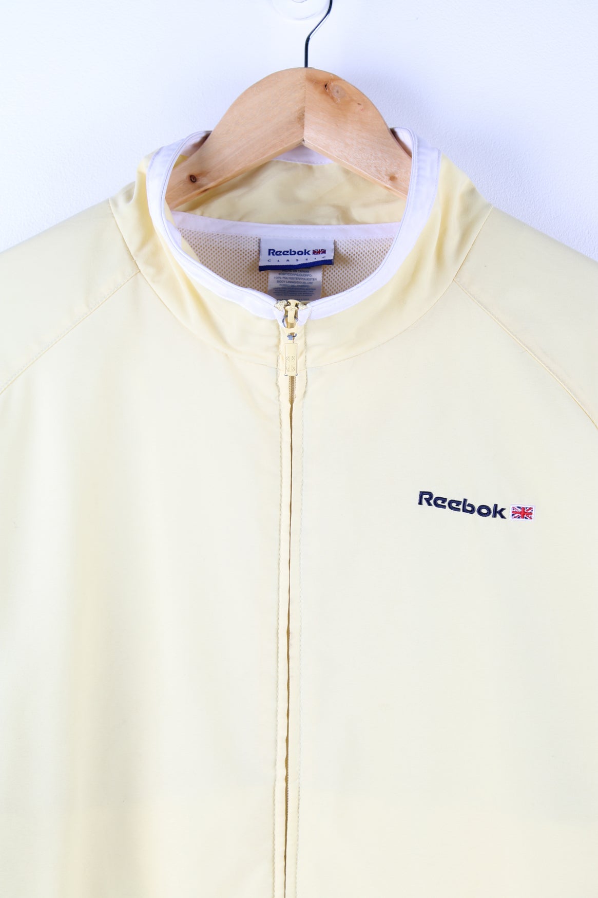 Reebok Classic tracksuit top in yellow.  Features embroidered logo on the chest.